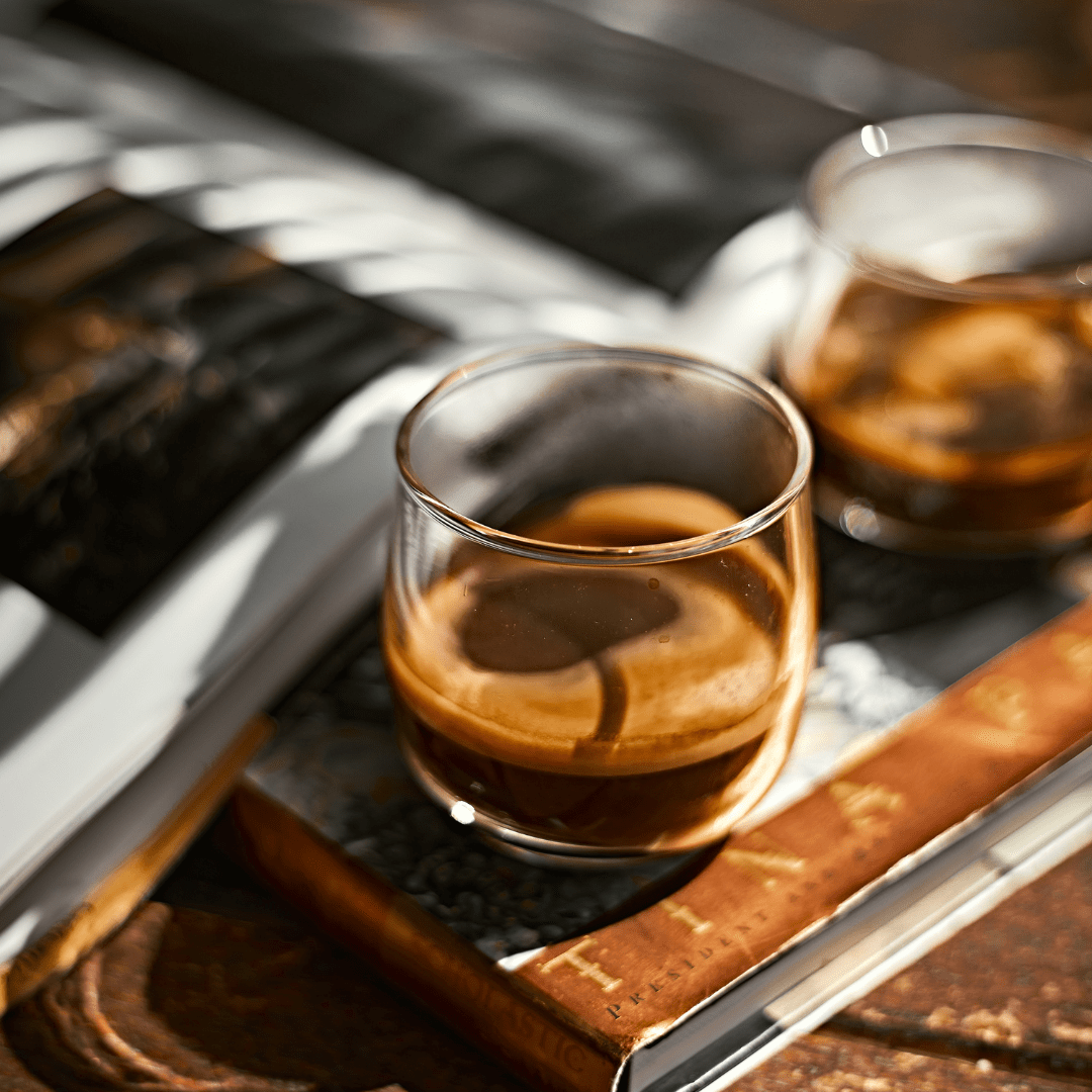 two cups of espresso in a glass